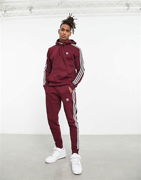 adidas jogginghose mit roten strrifen|adidas Originals – adicolor – Jogginghose in Burgunderrot mit .